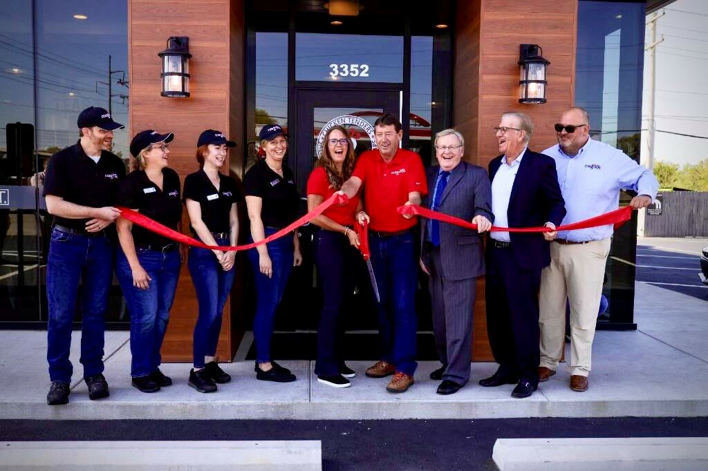 Officials hold a ribbon-cutting ceremony for the 3352 E. Sunshine St. restaurant.